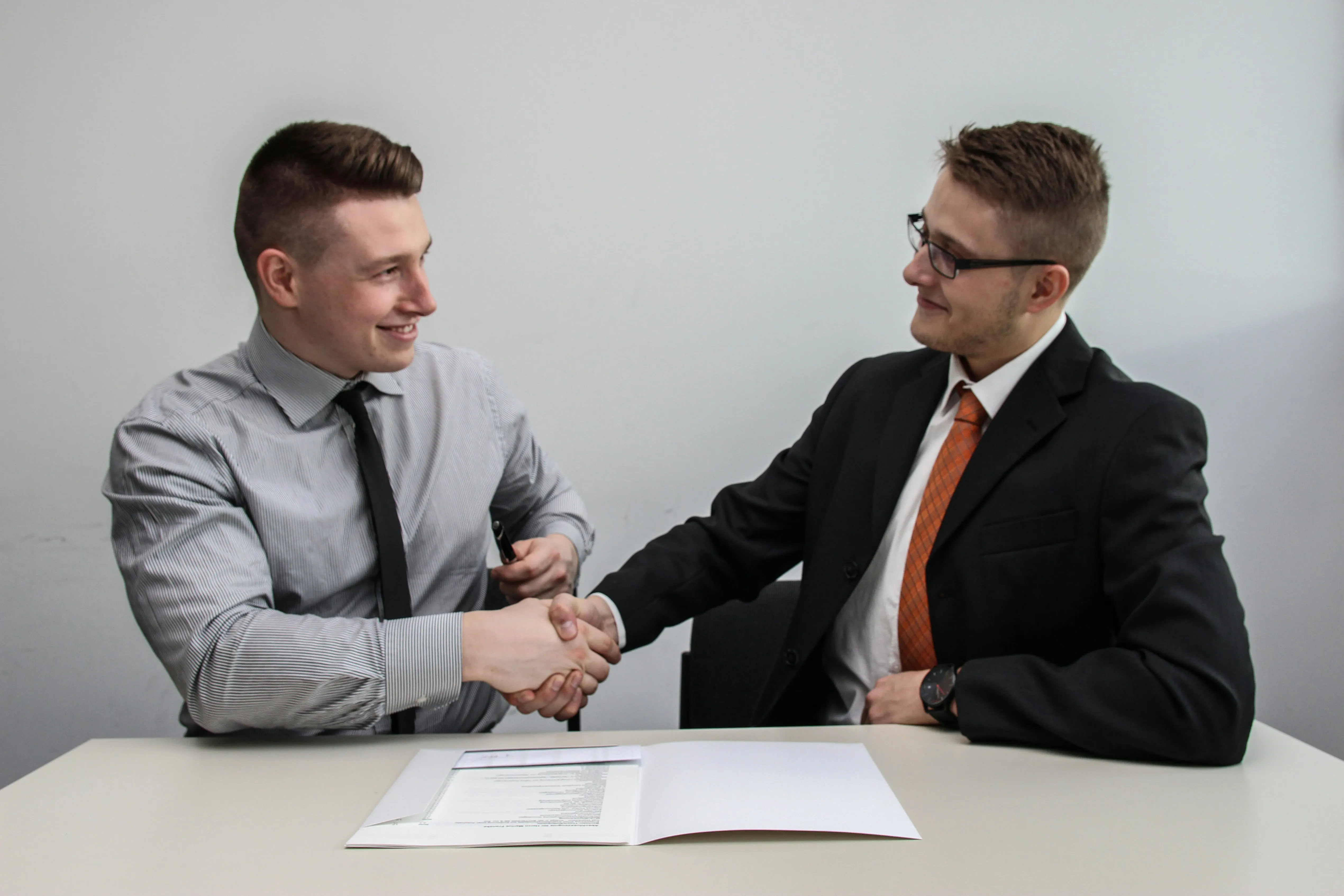 Two professionals validating a billing agreement